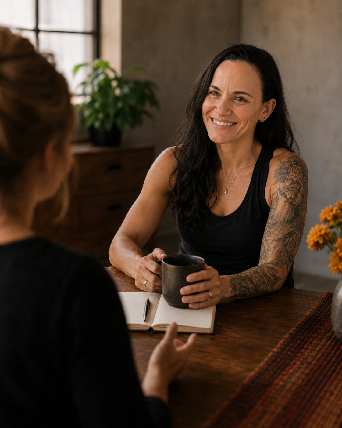 Intro conversation with notebook in a warm studio setting